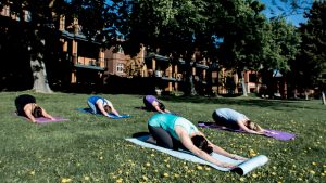 women doing yoga on the grass at Watermark