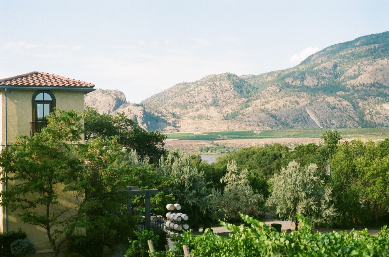 A winery building overlooking the desert hills of the Okanagan Valley.