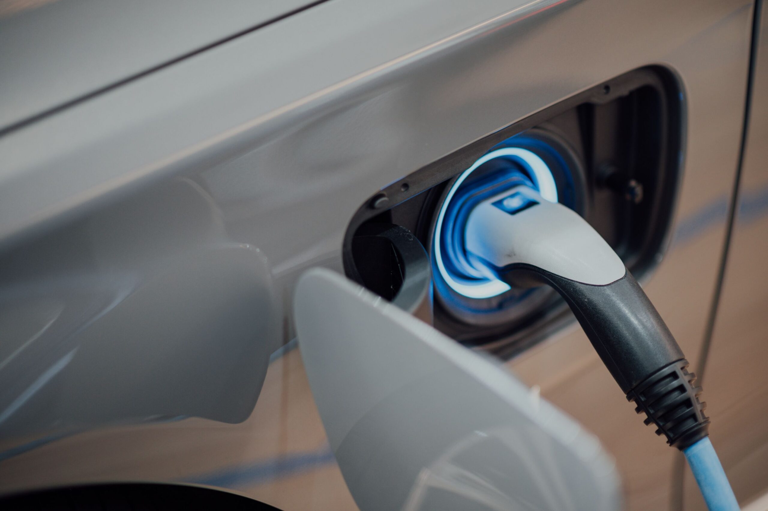 A charging handle plugged into an electric vehicle.