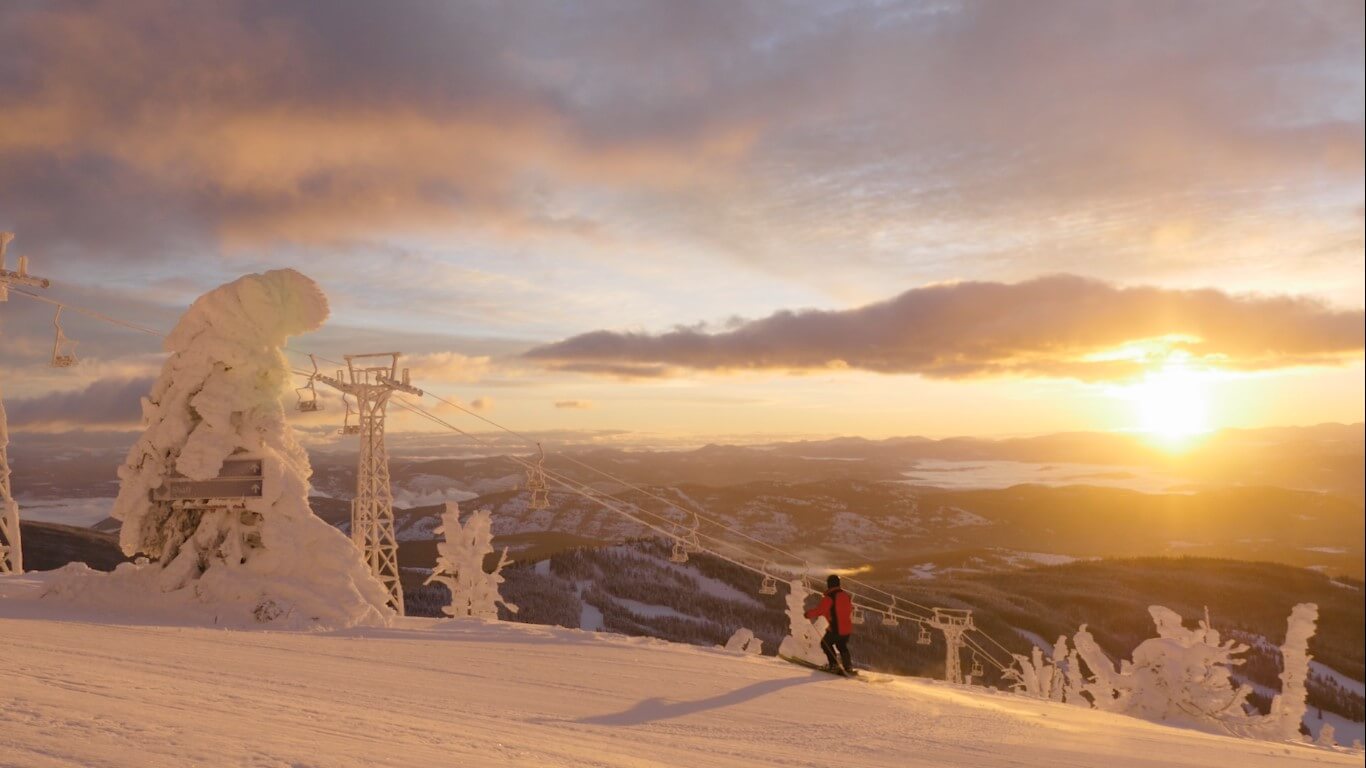 A skier admiring the view from a ski hill at Baldy Mountain Resort