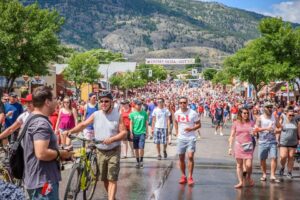 A crowd of people outdoors participating in the Cherry Fiesta