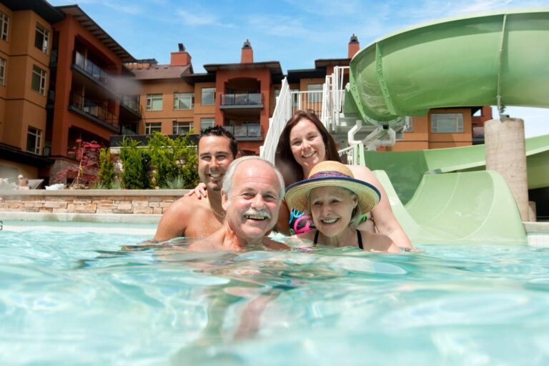 Multi-generational family enjoying the pool at Watermark Beach Resort during a reunion getaway