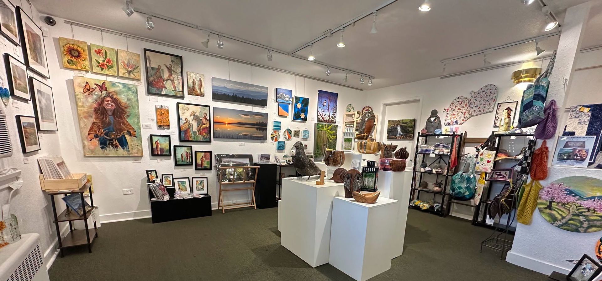 Paintings, pottery and handmade gifts on display inside The Art Gallery Osoyoos on Main Street