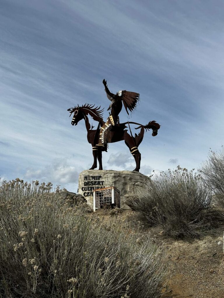 Metal sculpture of a rider on horseback at the entrance to the Nk’Mip Desert Cultural Centre in Osoyoos